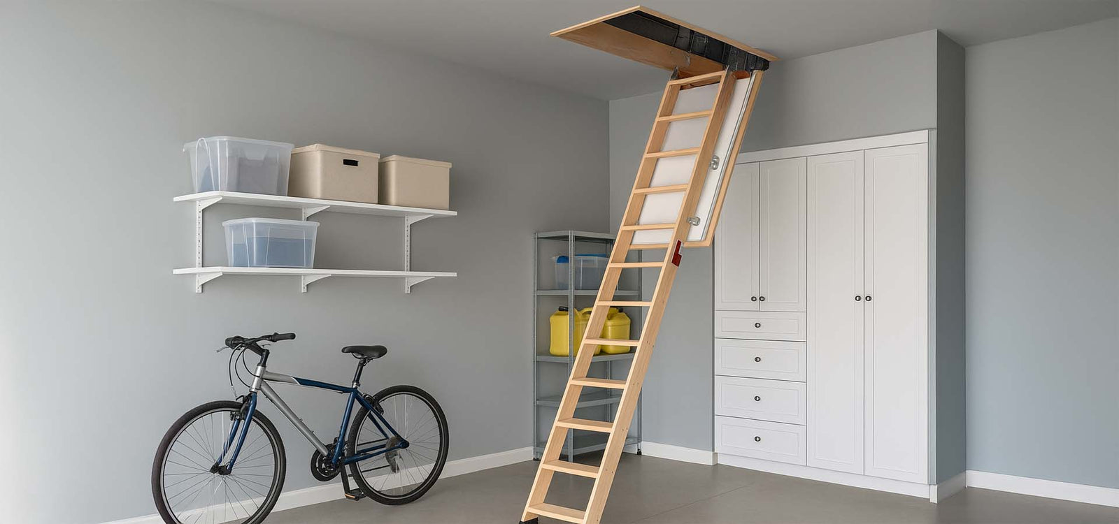 Organized garage with fold-down attic ladder. 