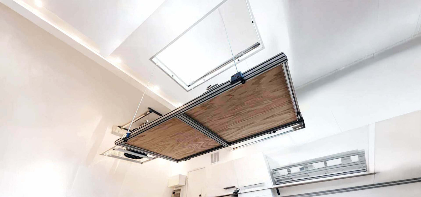 Auxx-Lift Attic Lift Descends From Open Ceiling Hatch