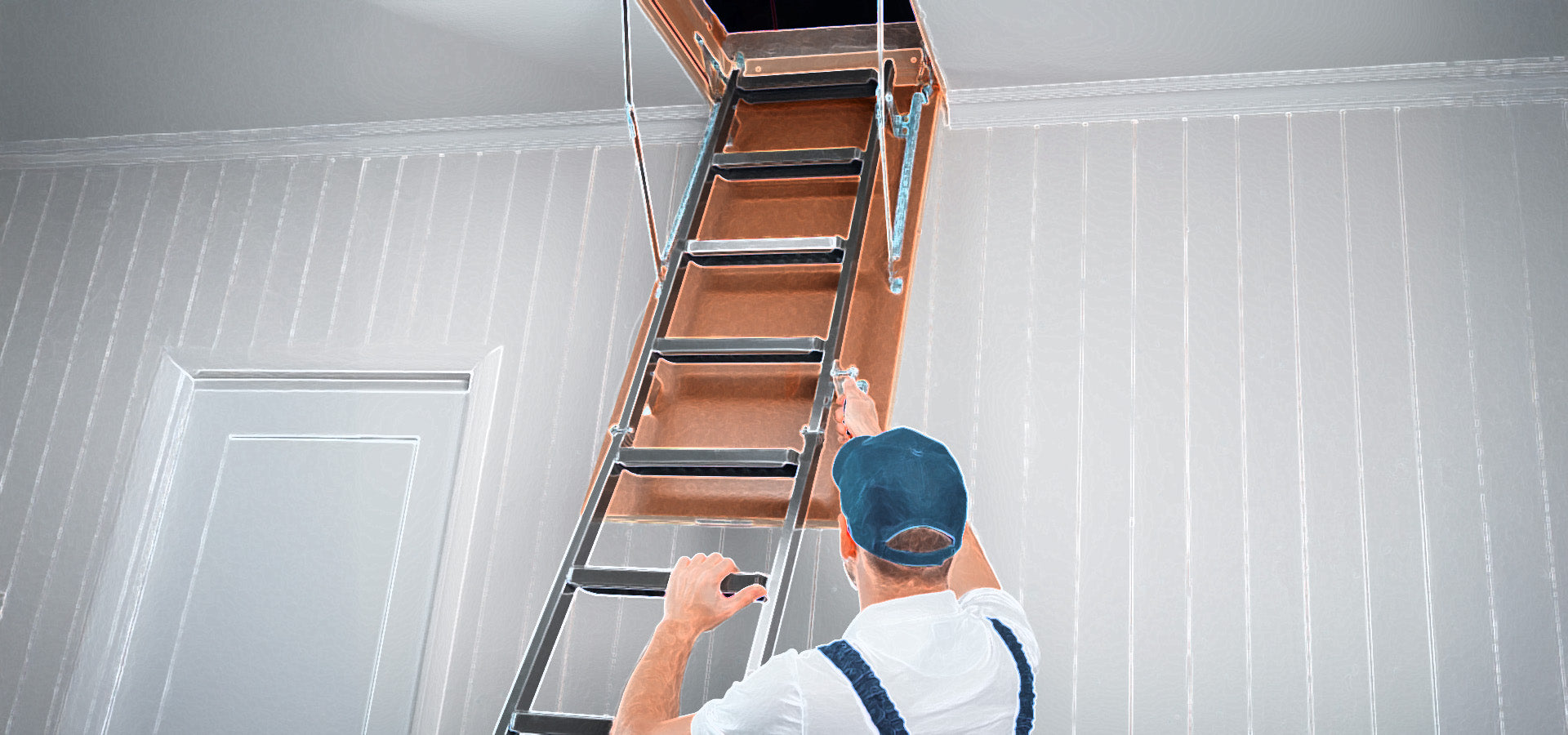 Metal Pull Down Attic Ladder Being Installed In Home