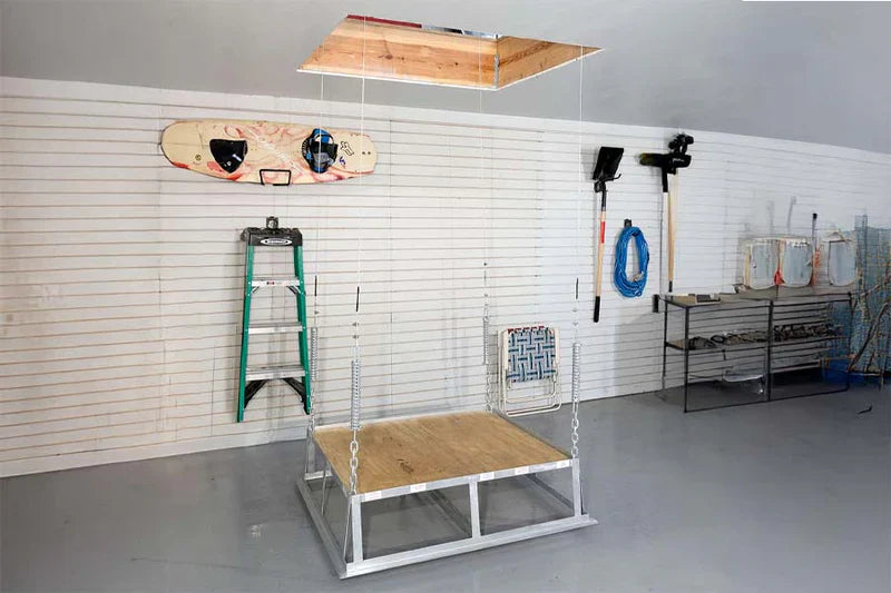 Workshop display with ladder, tools, and suspended platform.