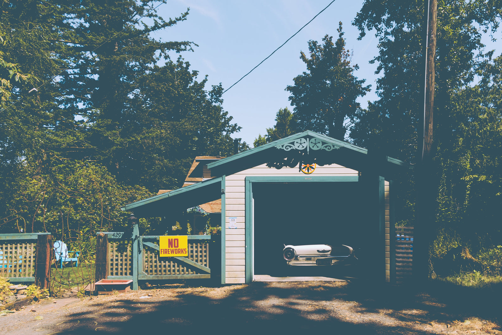 Old vintage car parked in a small garage 