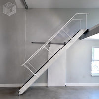 Majic Stair motorized retractable electric loft staircase with white-painted aluminum stringers, heavy-duty steel treads, and dual steel handrails. The pivoting stairway provides safe, convenient access to residential lofts and commercial mezzanines, then retracts to free up floor space below.