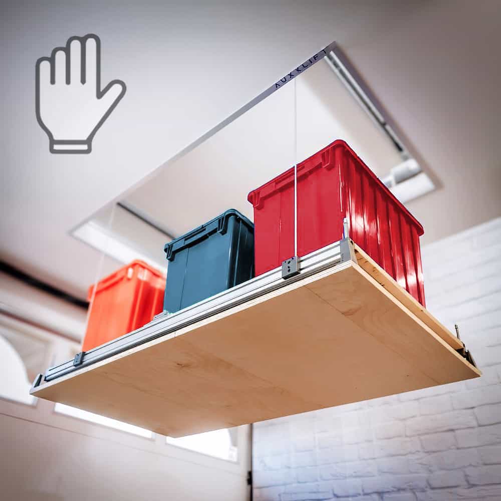 Lowered Auxx-Lift Attic-Lift platform with three recolored storage totes, viewed from below towards ceiling opening.