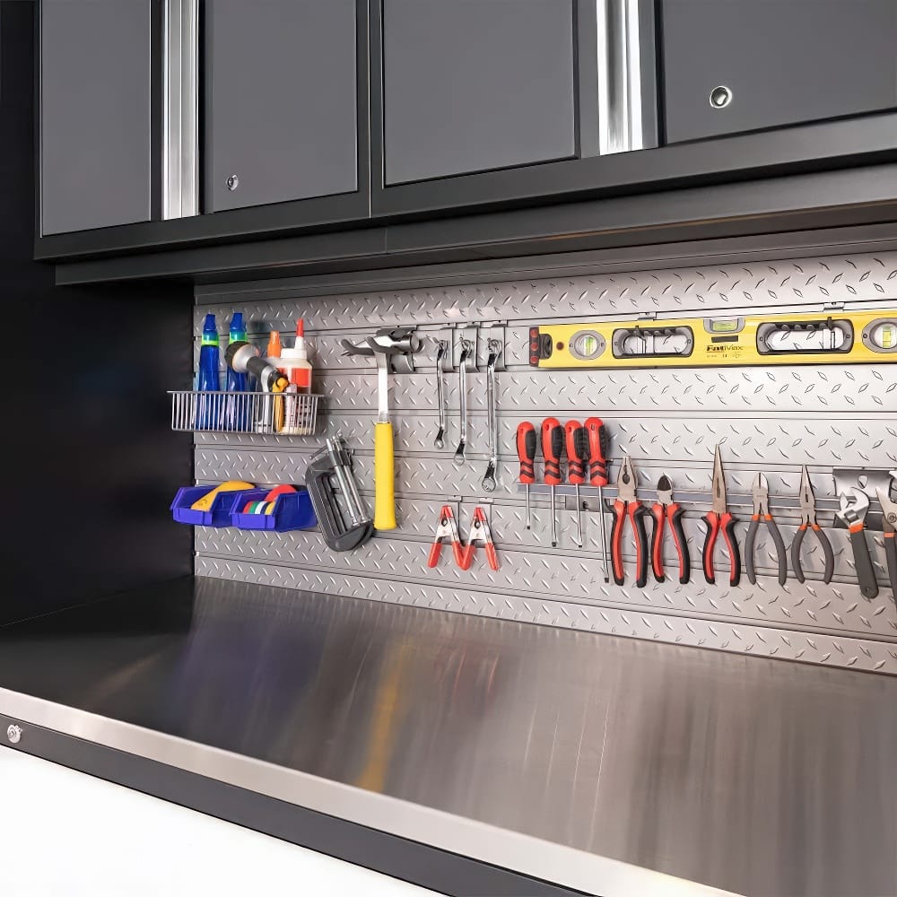 A Diamond Plate Backsplash Holds An Organized Array Of Hand Tools Sprays And Supplies Beneath Sleek Wall Cabinets
