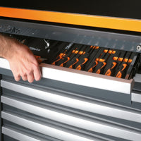 A Hand Pulls Open A Gray Beta Tool Cabinet Drawer Revealing Orange And Black Screwdrivers