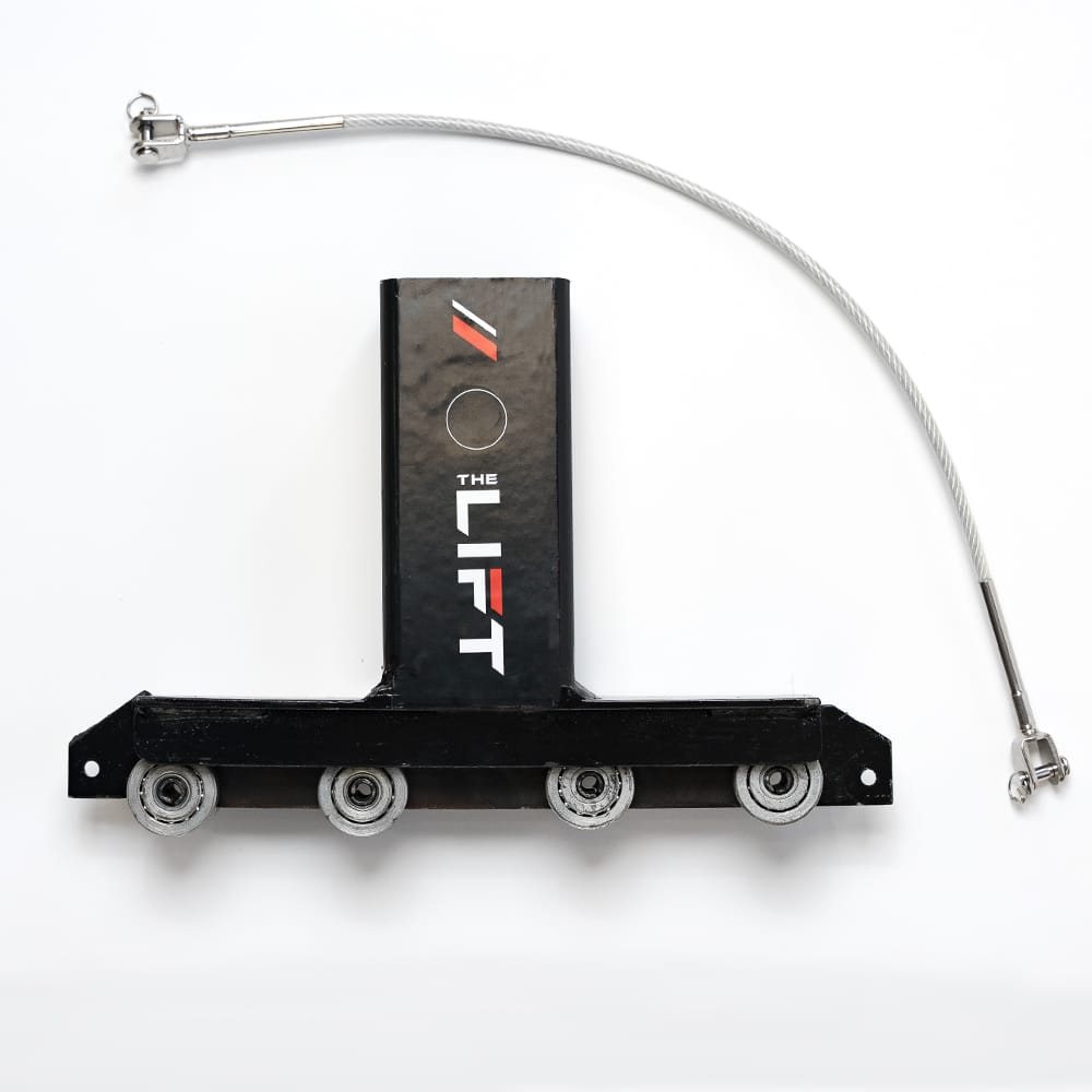 A Mechanical Component Featuring A Steel Cable Attached To A Rectangular Block With Rollers And Branded With The Lift Logo