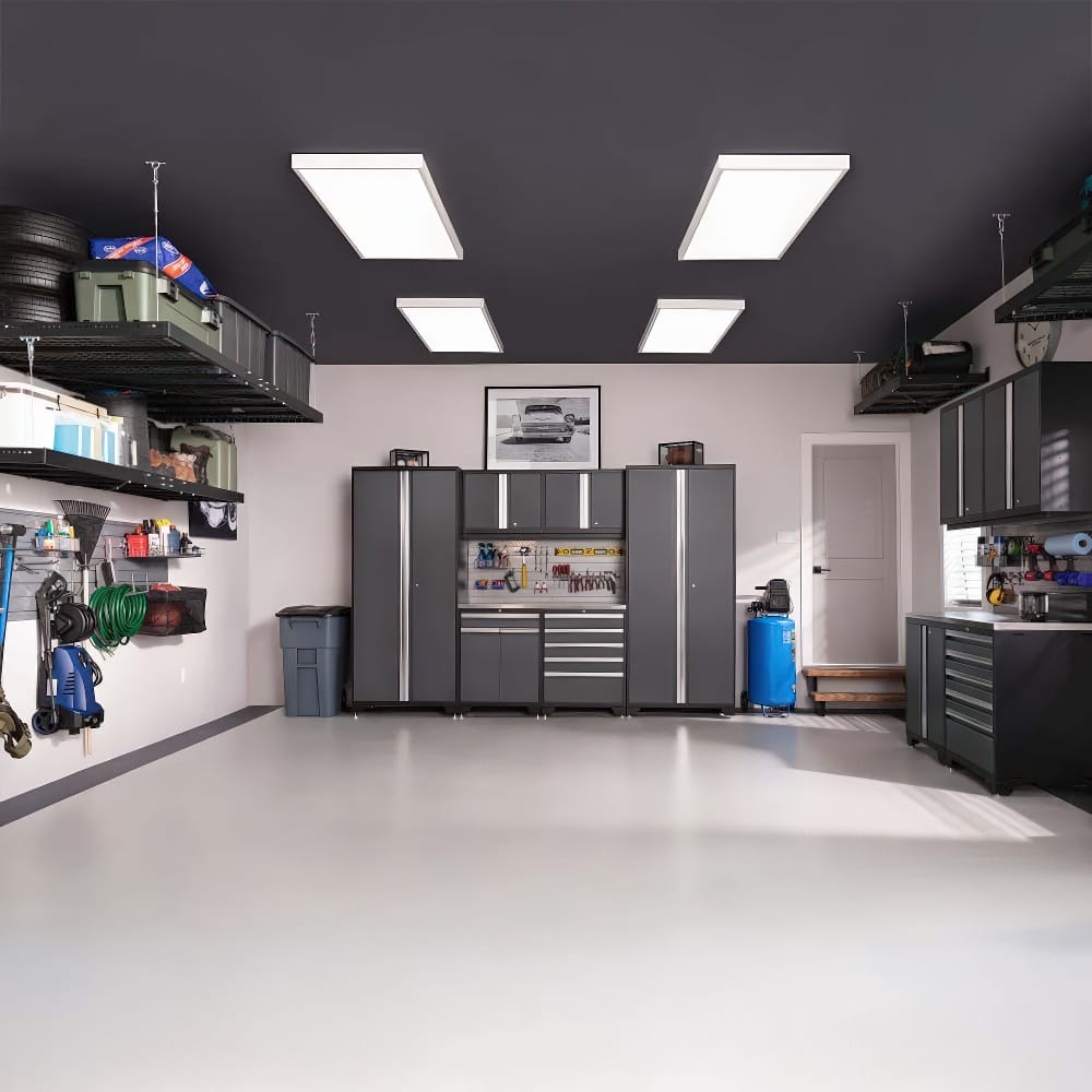 A Modern Well-Organized Garage Showcases A Complete Wall Of Sleek Black Cabinets Overhead Storage Racks And Mounted Tools