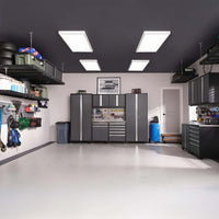 A Modern Well-Organized Garage Showcases A Complete Wall Of Sleek Black Cabinets Overhead Storage Racks And Mounted Tools