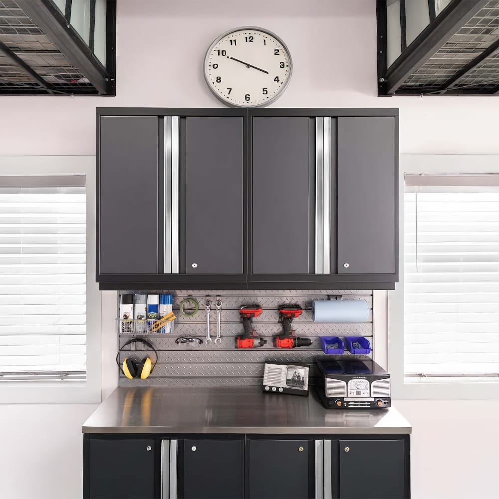A Tidy Garage Workspace Features Sleek Black Cabinets A Stainless Steel Countertop And A Neatly Organized Pegboard