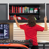 A Woman In A Red Shirt Is Organizing A Pro Series 42 In Wall Cabinet Filled With Automotive Supplies And Tools