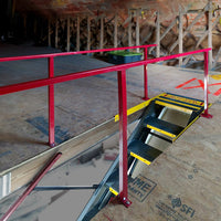 An Attic Space With A Sliding Attic Ladder And Red Safety Railings Was Installed Around The Opening