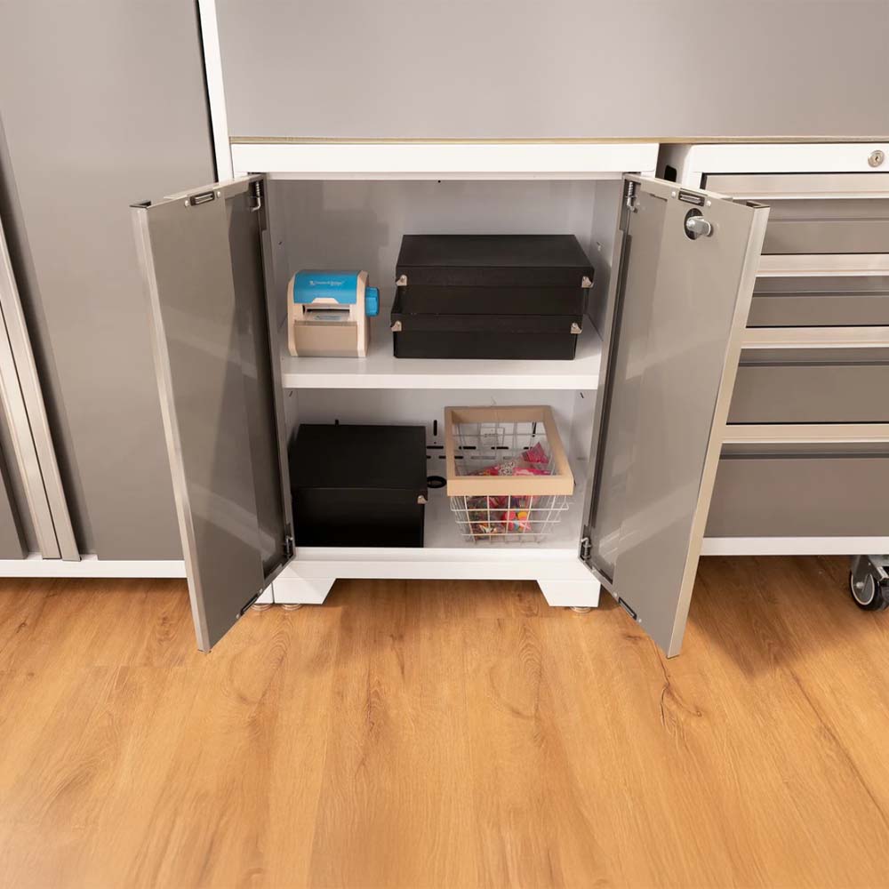 An Open Lower Cabinet With Two Gray Doors Revealing Organized Storage Items Inside