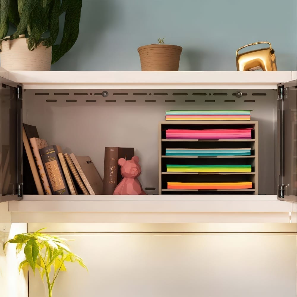 An Overhead Cabinet Displays A Mix Of Colorful Paper Trays Books And A Pink Bear-Shaped Decor Piece