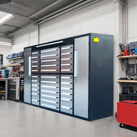 Angled View Of A Black And Silver Garage Storage System With Stacked Drawers