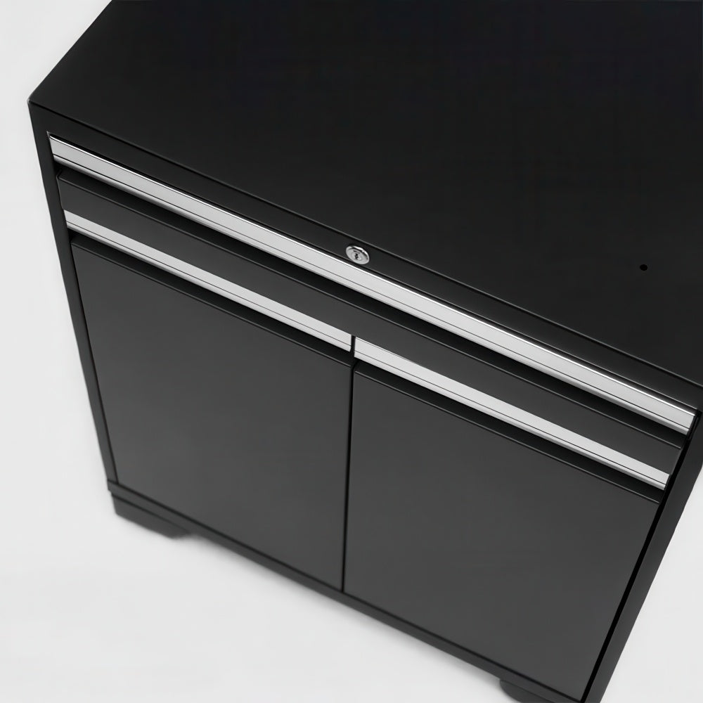Angled View Of A Black Garage Base Cabinet With Locking Top Drawer And Dual Lower Doors