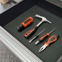 Assorted Hand Tools Lie On A Black Drawer Liner Inside An Open Toolbox Drawer