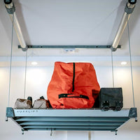 Auxx-Lift Platform Lift With Orange Bag Raised Up Toward Ceiling