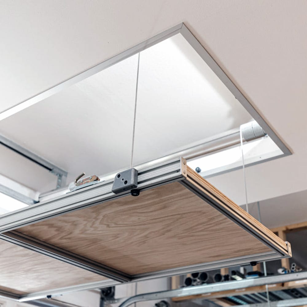 Auxx Lift Attic Lift Kit Partially Extended Through An Open Ceiling Hatch