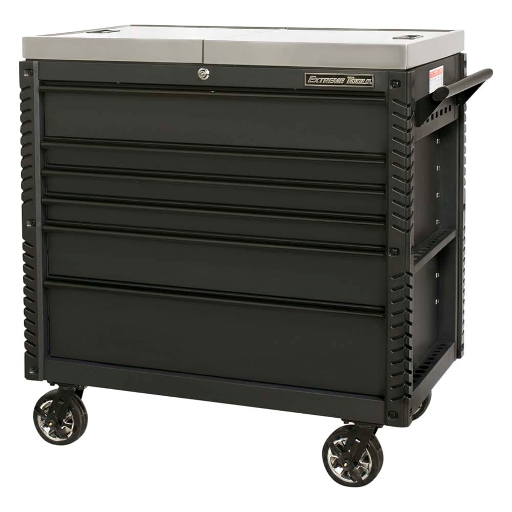 Black Extreme Tools Tool Chest Trolley With Black Drawer Handles, Caster Wheels, And A Stainless Steel Top With All Drawers Closed And A Handle On The Side