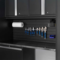 Black Garage Workstation With Blue Handled Tools Paper Towel Roll And Diamond Plate Backboard Above A Steel Countertop