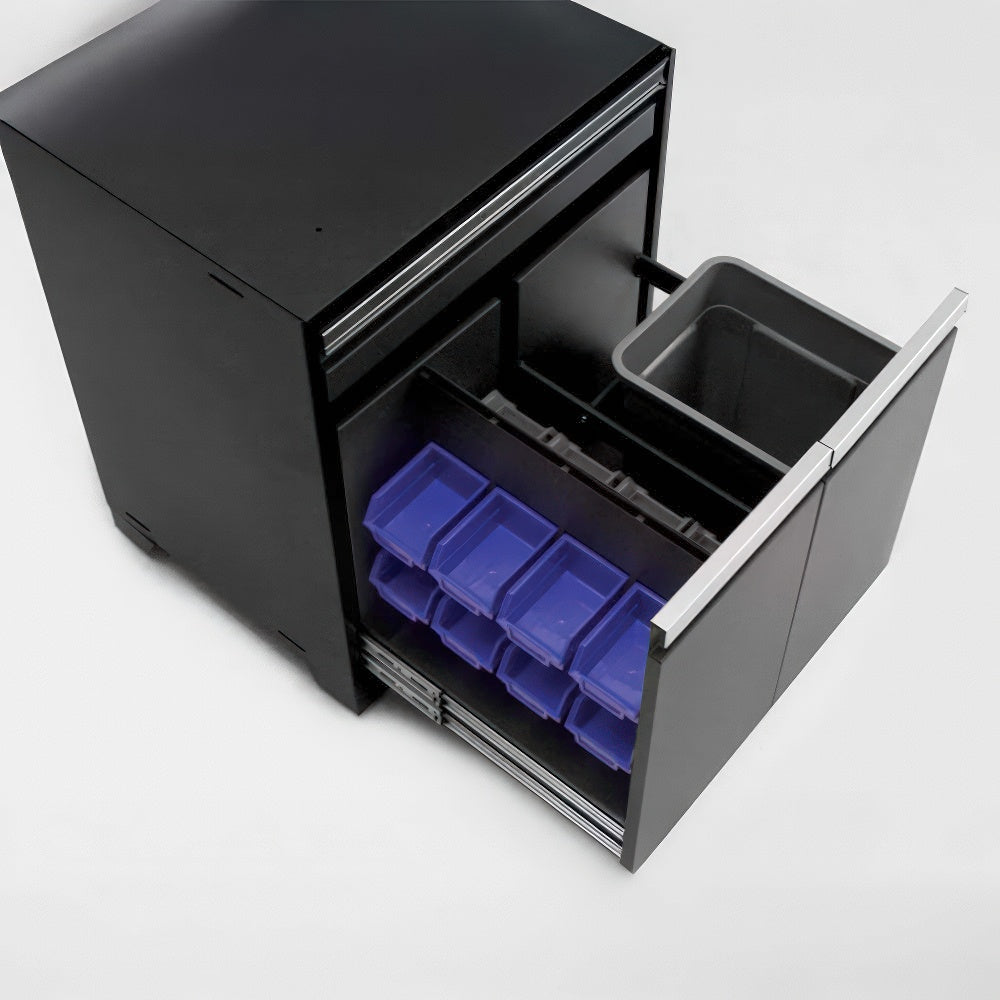 Black Storage Cabinet With A Fully Extended Lower Drawer That Contains Multiple Small Blue Bins And A Gray Waste Bin Insert