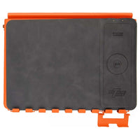 Black Wireless Charging Pad With The Extreme Tools Logo On The Bottom Right Corner And Orange Trim On The Top And Bottom Edges