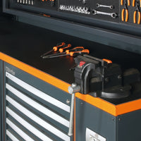 Black Workbench Surface With Orange Trim Bench Vise Loose Screwdrivers And Organized Hand Tools On The Overhead Pegboard