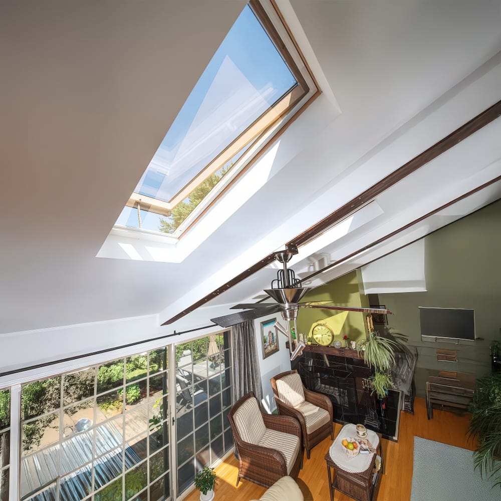 Bright Living Room With Slanted Ceiling Featuring An Opened Roof Window For Natural Light And Airflow