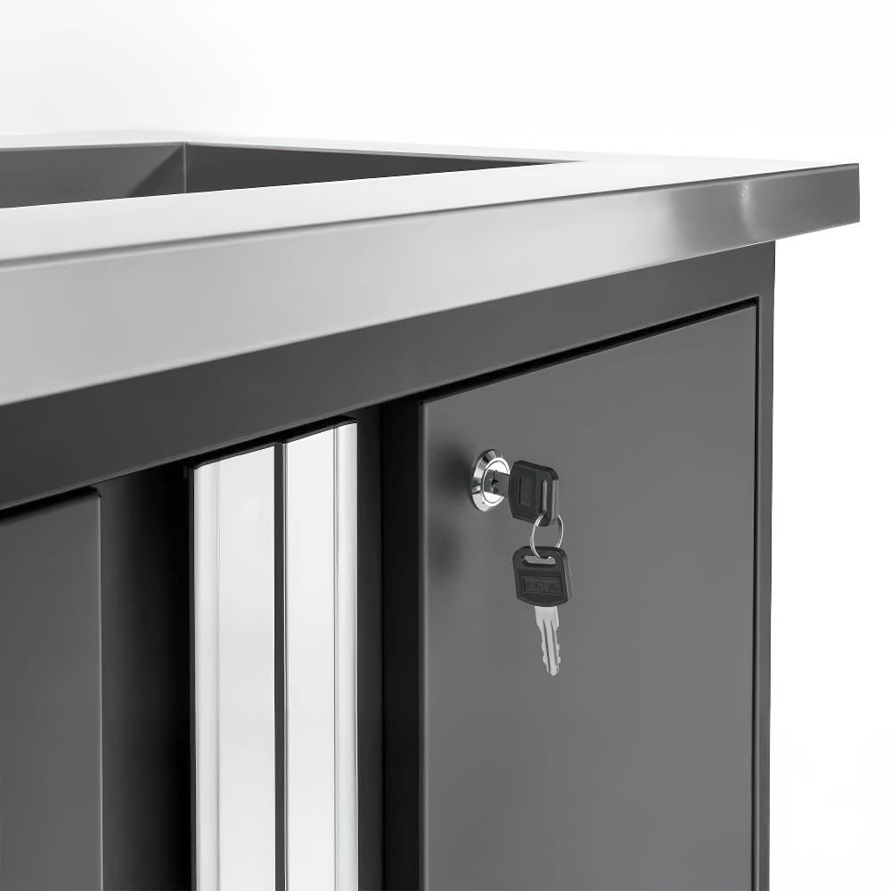 Cabinet With Keys Inserted In The Lock And A Sleek Stainless Steel Worktop