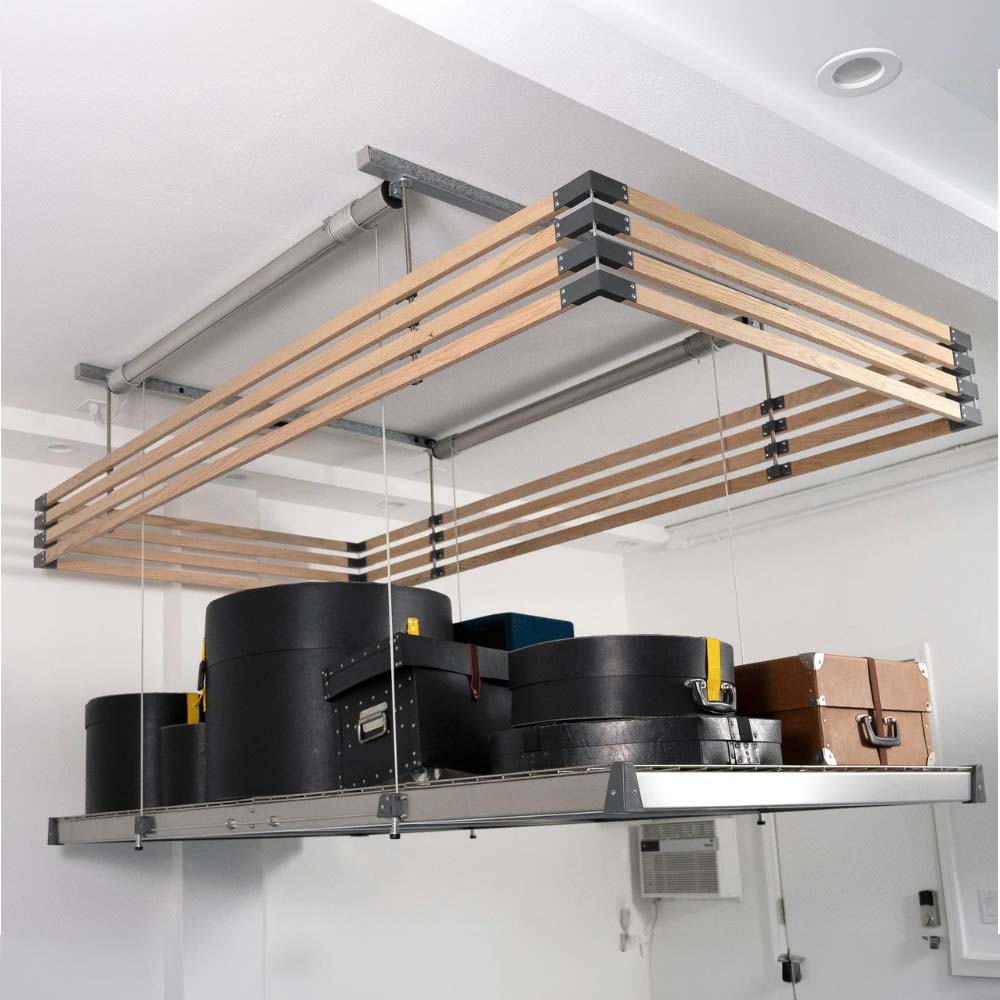 Ceiling Mounted Storage Rack With Auxx Fence Holding Various Black And Brown Cases And Boxes