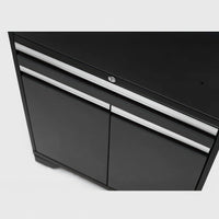 Close-Up Angled View Of A Sleek Black Cabinet With Two Doors And A Top Lockable Drawer Featuring Horizontal Silver Handles