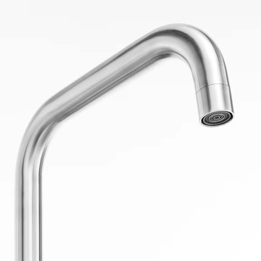 Close-Up Of A Curved Stainless Steel Faucet Spout