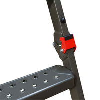 Close-Up Of A Foldable Metal Attic Ladder Featuring A Red Locking Hinge Mechanism And A Perforated Anti-Slip Step