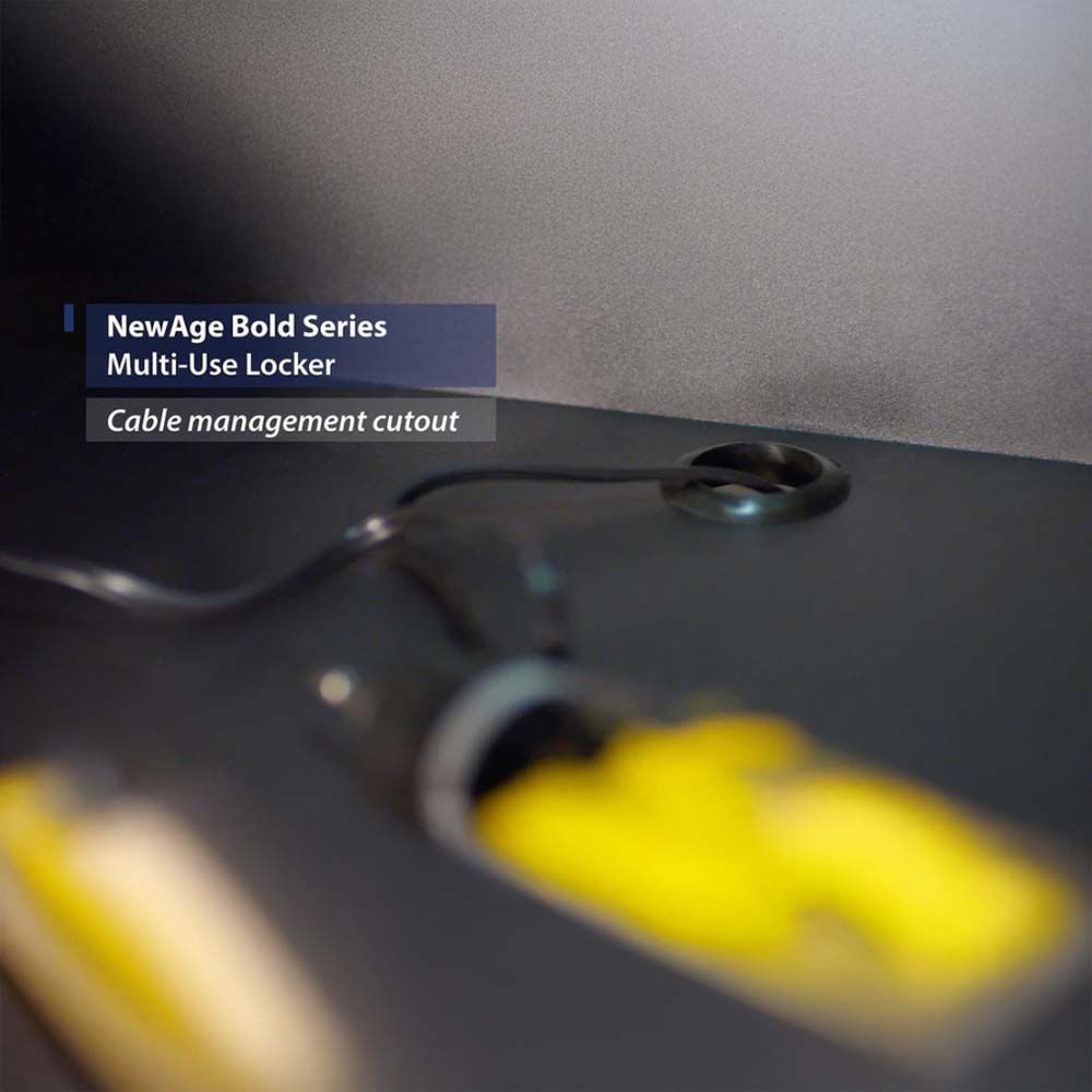 Close-Up Of A Locker Shelf With A Round Cable Grommet Through Which Power Cords From Tools Or Devices Are Neatly Routed