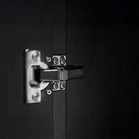 Close-Up Of A Metal Cabinet Hinge Securely Fastened With Multiple Screws Against A Matte Black Interior Surface