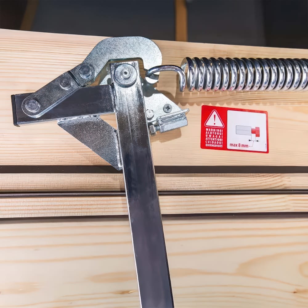 Close-Up Of A Metal Hinge And Spring Mechanism Mounted On A Wooden Attic Ladder Frame