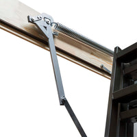 Close-Up Of A Spring-Loaded Metal Hinge Mechanism Attached To A Wooden Attic Hatch Frame