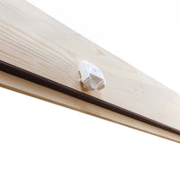 Close-Up Of A White Plastic Latch Or Locking Mechanism Mounted On A Light Wooden Surface Likely Part Of An Attic Ladder Hatch
