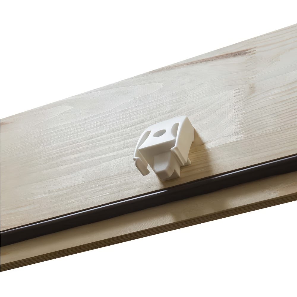 Close-Up Of A White Plastic Latch Or Locking Mechanism Mounted On A Wooden Attic Hatch Door