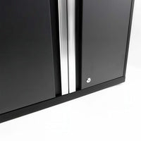 Close-Up Of Black Cabinet Doors With Silver Vertical Handles And Key Lock On A White Background