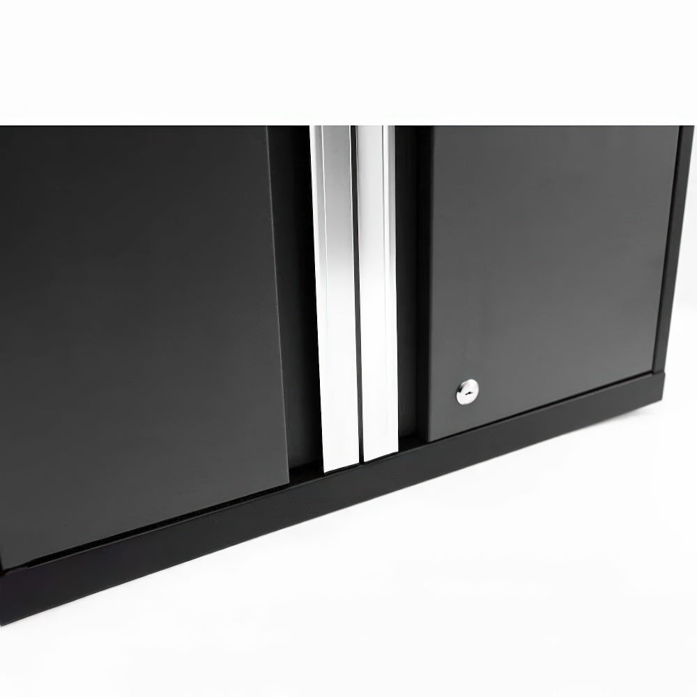 Close-Up Of The Bottom Section Of A Black Cabinet With Two Doors Featuring Vertical Silver Handles And A Lock Mechanism On The Right