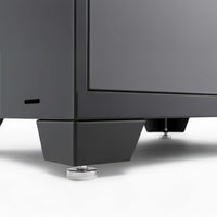 Close-Up View Of A Black Cabinet Corner With Sturdy Metal Feet And Adjustable Leveling Pads