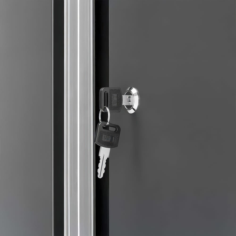 Close-Up View Of A Metal Cabinet Door With A Chrome Lock And Inserted Keys