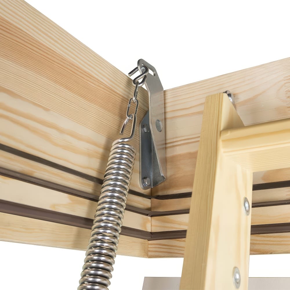 Close-Up View Of A Metal Spring Mechanism Attached To A Wooden Attic Ladder Frame