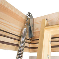Close-Up View Of A Metal Spring Mechanism Attached To A Wooden Attic Ladder Frame