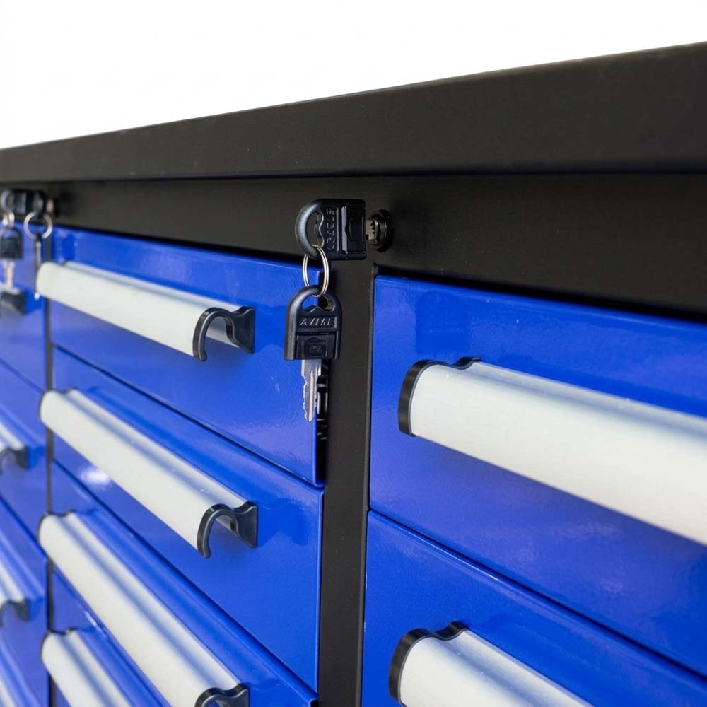 Close Up Of A Blue Tool Cabinet With Silver Drawer Pulls And A Lock With Keys