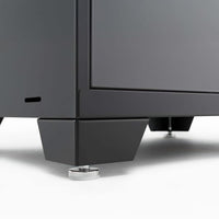 Close Up Of A Cabinet Leg With Adjustable Leveling Feet On A Smooth White Surface