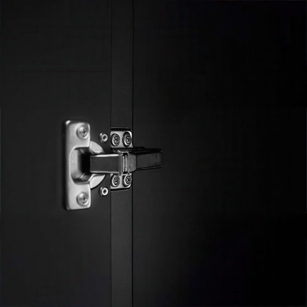 Close Up Of A Chrome Cabinet Hinge Mounted On A Dark Matte Door Surface