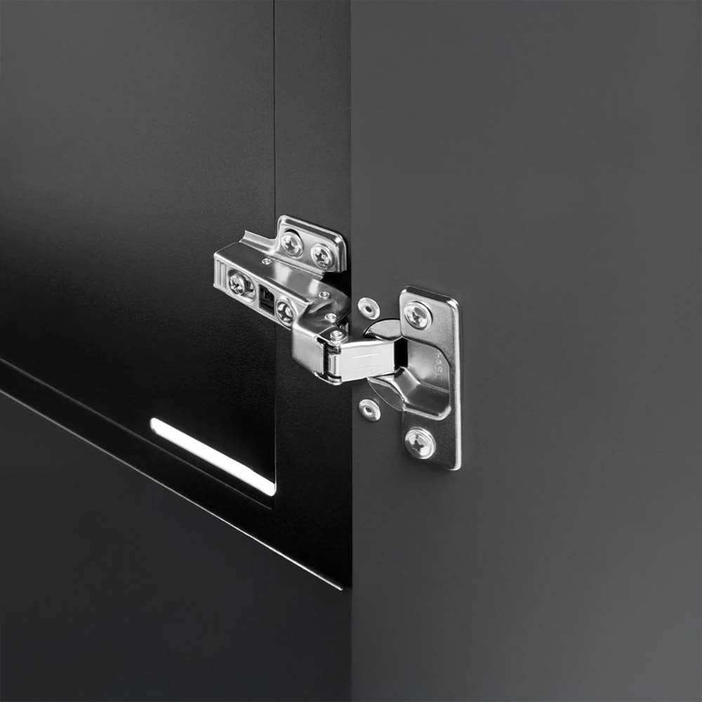 Close Up Of A Chrome Soft Close Hinge Mounted On A Dark Cabinet Door