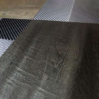 Close Up View Of A Modular Garage Floor With A Combination Of Dark Textured Racedeck Flooring